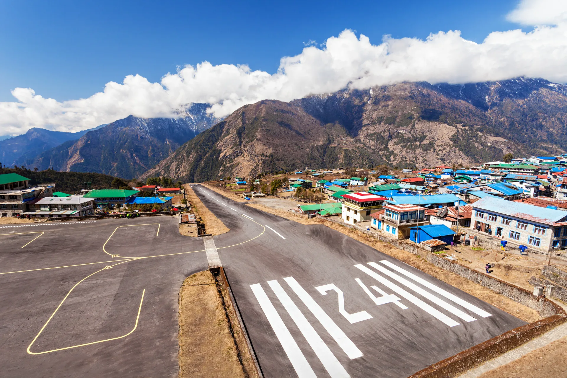 Everest helicopter tour cockpit — pilot flying over the Khumbu Valley